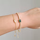 gold tennis emerald baguette bracelet